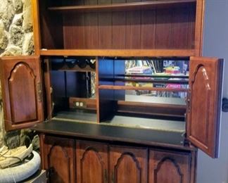 Beautiful two piece bar with lights on two levels, outlet and hook up for cable TV. Wine glass holder, wine bottle holder and lot's of storage in bottom.