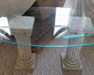 Oval glass table with columns