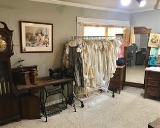 Grandfather clock, trestle sewing machine, folding clothing rack, linens, “whites”, christening garments, accessories