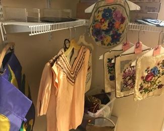 Embroidered pillow cases, vintage clothes and bags