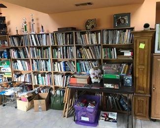 Many books, particularly on dogs and breeding; VHS tapes and cabinets