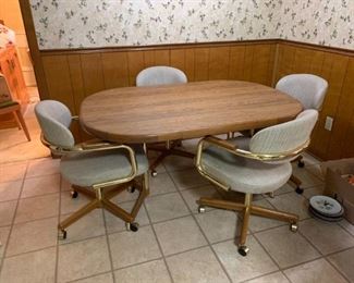 #1	laminate table with 1 leaf and 4 rolling chairs 	 $ 100.00 