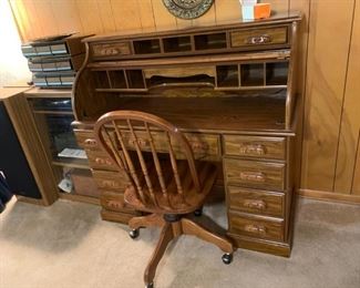 #22 desk laminate roll top desk w 9 drawer and roll top desk 50x22x47  $ 75.00 
#23 chair desk chair wood arch back   $ 75.00