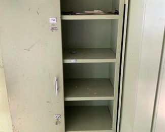 #44 metal cabinet with 2 doors  and 4 shelves 30x15x66  $ 65.00