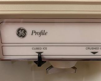 #49 GE  almond freezer on top frig with ice water in the door 34.5x31x67  $ 150.00