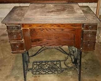 Antique Minnesota A treadle sewing machine in original cabinet