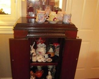 old radio cabinet, fenton  glassware.  porclain dolls