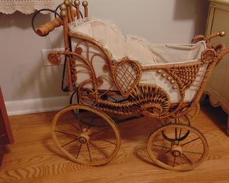 Small, wicker doll buggy