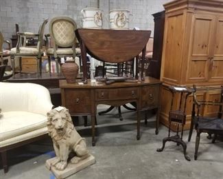 concrete statuary, drop leaf tables, pine cabinet, settee, plant stand
