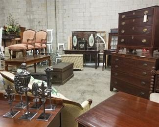 metal finial decor, mahogany chests, upholstered arm chars, painted trunks, desks