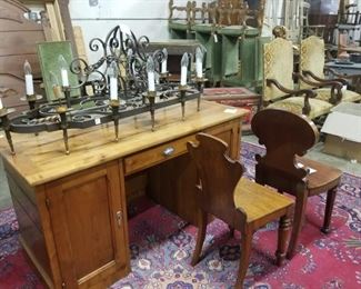 wood desk, English hall chairs, iron chandelier, upholstered dining chairs
