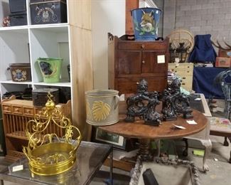 iron fireplace decor, round hall tables, painted metal buckets and planters