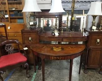brass lamps, demilune, secretaries, books