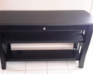 Pretty black sofa/entryway table with 2 shelves and 1 drawer.