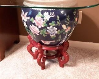 Glass top end table with Asian planter and wood base.