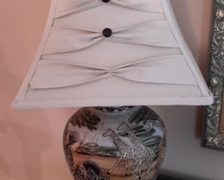 Very pretty ceramic lamp with African animal scene.