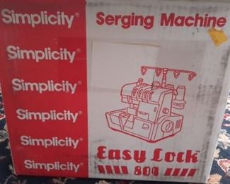Like new, in box, Simplicity Serging Machine. (Lots of serging thread as well - sold separately).