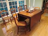 Beautiful cherry sheraton drop leaf and six caned bottom side chairs