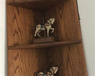 Corner shelf with carousel horses