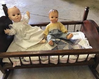 Vintage cradle and dolls