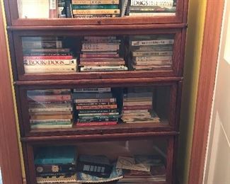 Lawyers bookcase with large assortment of books on dogs
