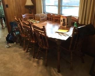 Table and 8 chairs with leaf