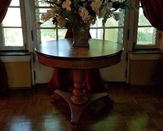 36" round pedestal foyer table. Flower painted top. Eye-catching floral arrangement, 3' of magnolias and lilies