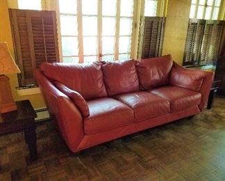 Modern leather-look sofa, attached pillows, excellent condition.  Dimensions  90"W X 32" H X 38" D.  Pair of HOME brand end tables, many table lamps.