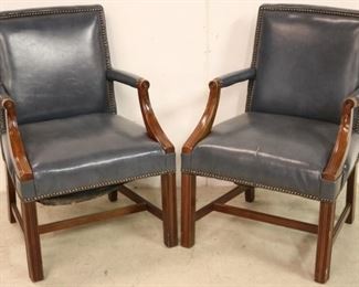 Vintage pair leather arm chairs