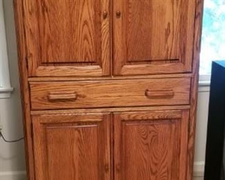 Solid Oak TV cabinet that can be used as Armoire. 36x64 with 23" depth $50.00