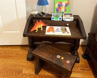 92- Vintage solid wood child's desk measures 25.5"l x 15.5"w x 19" h, toys