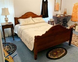 71- Carved wood full size bed with clean embroidered quilt bedspread set, drop leaf wood side table 16" w (without leaves) x 33"w (with leaves) x 16.5" deep x 28" tall