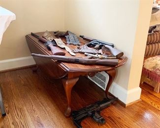 10- Roy Rogers rifle, holsters and assorted vintage TOY firearms. Drop leaf oval coffee table measures 50"L x 19.5" w (leaves down) x 36" w (leaves up) 