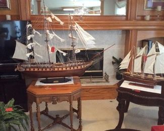 Large model of U.S.S. Constitution with a smaller three masted schooner.