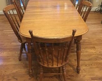 Oval oak table with six chairs