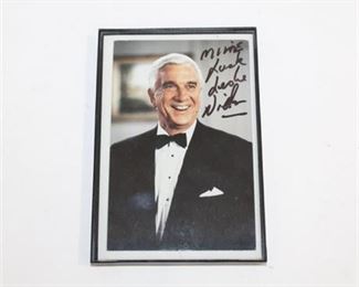Lot 157 
Leslie Nielsen Framed Photo Signed