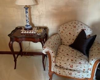 Upholstered chair and cherry stand.