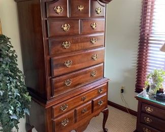 Cherry high boy which is part of the queen bedroom suite.