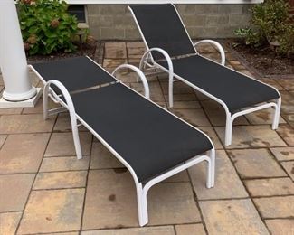 Two adjustable chaise lounges.
