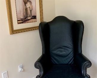 Vintage Romweber Leather Armchair feat. nailhead trim and carved oak base.