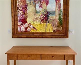 Pretty cherry two-drawer table looking lovely below original oil by Misha, Russian born artist. Painting is 62 x 48.