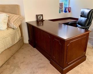 "L" section desk - on the smaller side and in excellent condition. We also have a black leather office chair hiding behind that desk!