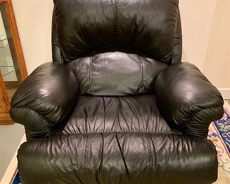 Virtually new, black leather recliner