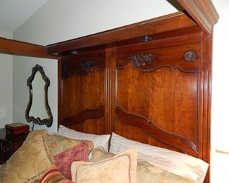 intricate headboard carving on king size Drexel Heritage bed