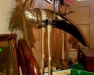 Bird statue made of cow horn and metal