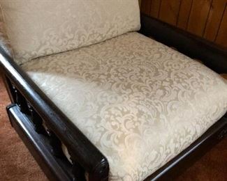 Solid wood base, cushion covers have zippers and are removable