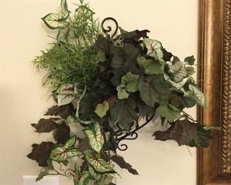 Artificial greenery attached to metal rack 