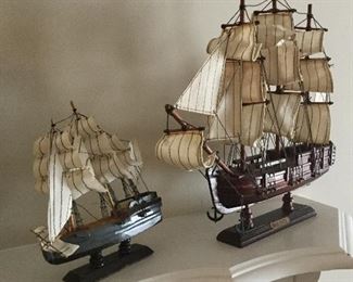 Small decorative ship and other ships name is “Bounty”