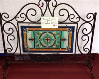 Wrought iron fireplace screen with glass inset