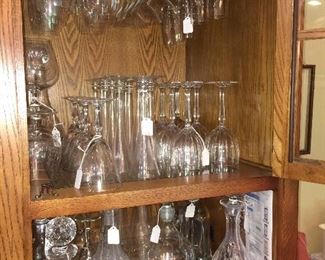 Interior of wine and spirit cabinet with beautiful crystal decanters and Riedel stemware